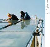 An example of a rooftop solar water heater being built in South Africa