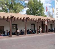 Indians selling handmade goods in front of the Palace of the Governors