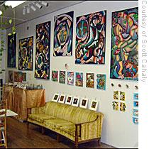 Scott Cahaly's studio is packed with art, and he has traded one painting for a visit to the dentist