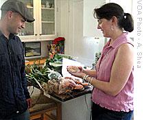 Valerie Gates receives fresh foods and prepared meals from farmer Jake Ferreira in exchange for her marketing advice