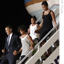 The President and first Lady Michelle Obama arrive in Accra, Ghana, with daughters Sasha and Malia