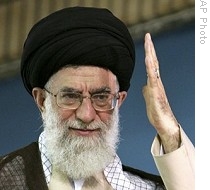 Iranian supreme leader Ayatollah Ali Khamenei waves to the crowd during a religious ceremony, warning Western governments against