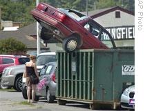 At a dealer in Springfield, Vermont, an old car is used as a promotion for the 'cash for clunkers' program.