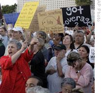 A woman expressing her opposition to health care reform during a town hall meeting in Alhambra, California on Tuesday