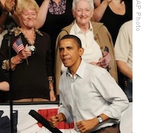 President Barack Obama climbs the stairs prior to addressing a health care reform rally at Target Center in Minneapolis