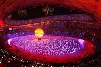 A general view is seen while Sarah Brightman and Liu Huan sing on top of a large globe during the Opening Ceremony for the Beijing 2008 Olympic Games at the National Stadium on August 8, 2008 in Beijing, China. (Photo credit: Mike Hewitt/Getty Images)