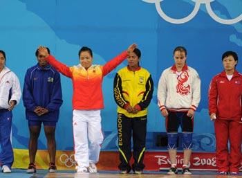 Chen Yanqing of China (L3) waves to spectators before women's weightlifting 58kg Group A competition of Beijing 2008 Olympic Games at Beijing University of Aeronautics & Astronautics Gymnasium in Beijing, China, Aug. 11, 2008.(Xinhua/Yang Lei)