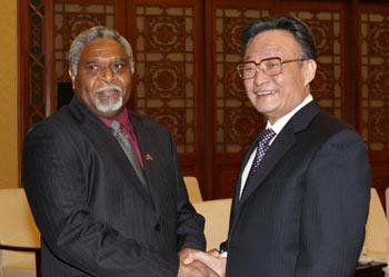 Wu Bangguo (R), chairman of the Standing Committee of the National People's Congress, shakes hands with Vanuatu parliament speaker Sam Dan Avock in Beijing, China, Feb. 25, 2008. China and Vanuatu on Monday pledged to continue to promote bilateral relations and step up inter-parliamentary cooperation. (Xinhua Photo)
