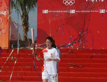 China's short track speed skating Olympic champion Yang Yang became the first torchbearer.