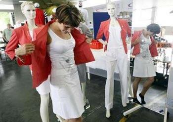 Hurdler&nbsp;Carolin&nbsp;Nytra&nbsp;tries&nbsp;her&nbsp;new&nbsp;uniform&nbsp;during&nbsp;the&nbsp;official&nbsp;outfitting&nbsp;of&nbsp;the&nbsp;German&nbsp;team&nbsp;for&nbsp;the&nbsp;upcoming&nbsp;Beijing&nbsp;Olympic&nbsp;Games&nbsp;in&nbsp;MainzJuly9,2008.REUTERS/Alex&nbsp;Grimm&nbsp;