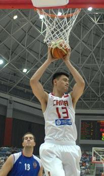 China's Yao Ming (Top) grabs a rebound during the game against Serbia at the Stankovic Cup basketball Olympic warmup tournament in Hangzhou, capital of east China's Zhejiang Province, July, 17, 2008.(Xinhua Photo)