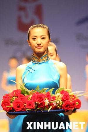 A&nbsp;model&nbsp;displays&nbsp;the&nbsp;dress&nbsp;for&nbsp;Olympics&nbsp;medal&nbsp;ceremony&nbsp;hostesses&nbsp;at&nbsp;a&nbsp;press&nbsp;conference&nbsp;in&nbsp;Beijing&nbsp;on&nbsp;Thursday,&nbsp;July&nbsp;17,&nbsp;2008.&nbsp;[Photo:&nbsp;Xinhua]