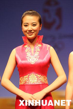 A&nbsp;model&nbsp;displays&nbsp;the&nbsp;dress&nbsp;for&nbsp;Olympics&nbsp;medal&nbsp;ceremony&nbsp;hostesses&nbsp;at&nbsp;a&nbsp;press&nbsp;conference&nbsp;in&nbsp;Beijing&nbsp;on&nbsp;Thursday,&nbsp;July&nbsp;17,&nbsp;2008.&nbsp;[Photo:&nbsp;Xinhua]