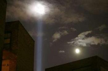 On the eve of the seventh anniversary of the September 11 attacks on the World Trade Center in New York, the annual "Tribute in Lights" is tested in Manhattan as a moon rises in the evening sky, seen from Hoboken, New Jersey, September 10, 2008.REUTERS/Gary Hershorn (UNITED STATES)